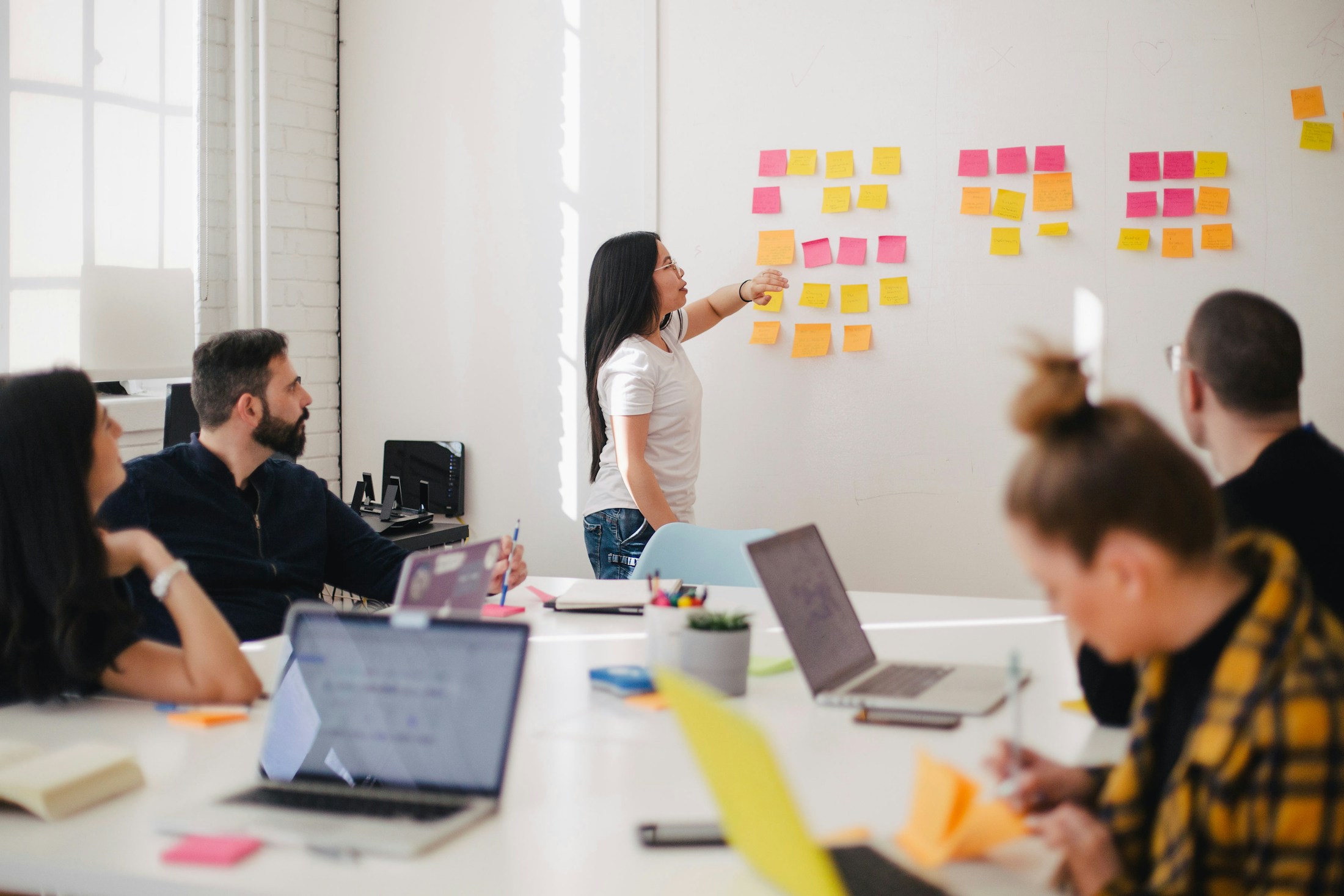 Product team collaborating in a workshop with sticky notes